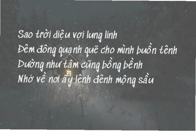 Cô gái ngồi một mình nhìn ra cửa sổ đêm